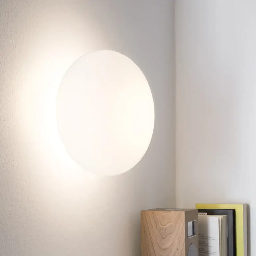 Elegant Nemo Lighting Maga wall ceiling lamp with an elliptical opal blown glass sphere and matte white finish