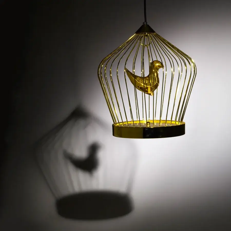 Lavish Casamania Twee T suspension lamp with a 24 carat gold-plated metal rod cage and illuminated bird within
