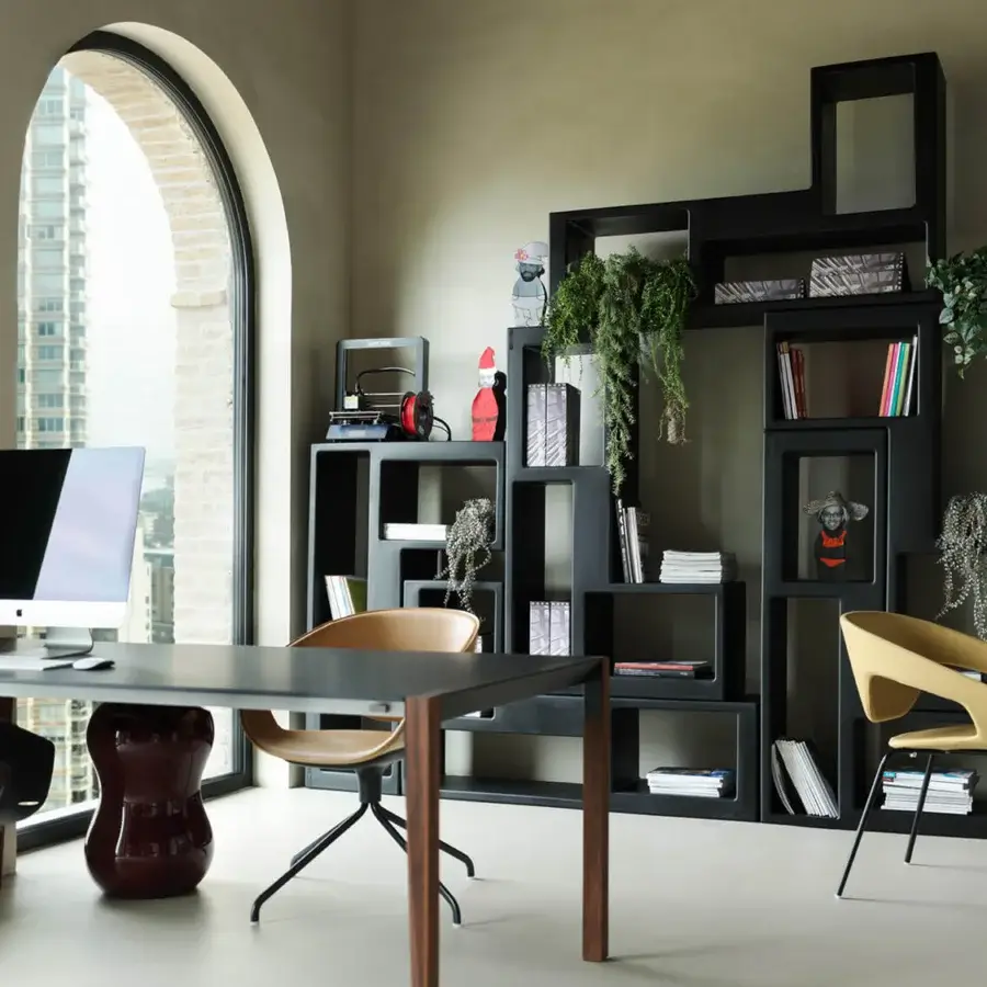 Distinguished Casamania Urban Bookcase shelving built in dark matte polyethylene with an asymmetrical carved monolithic form