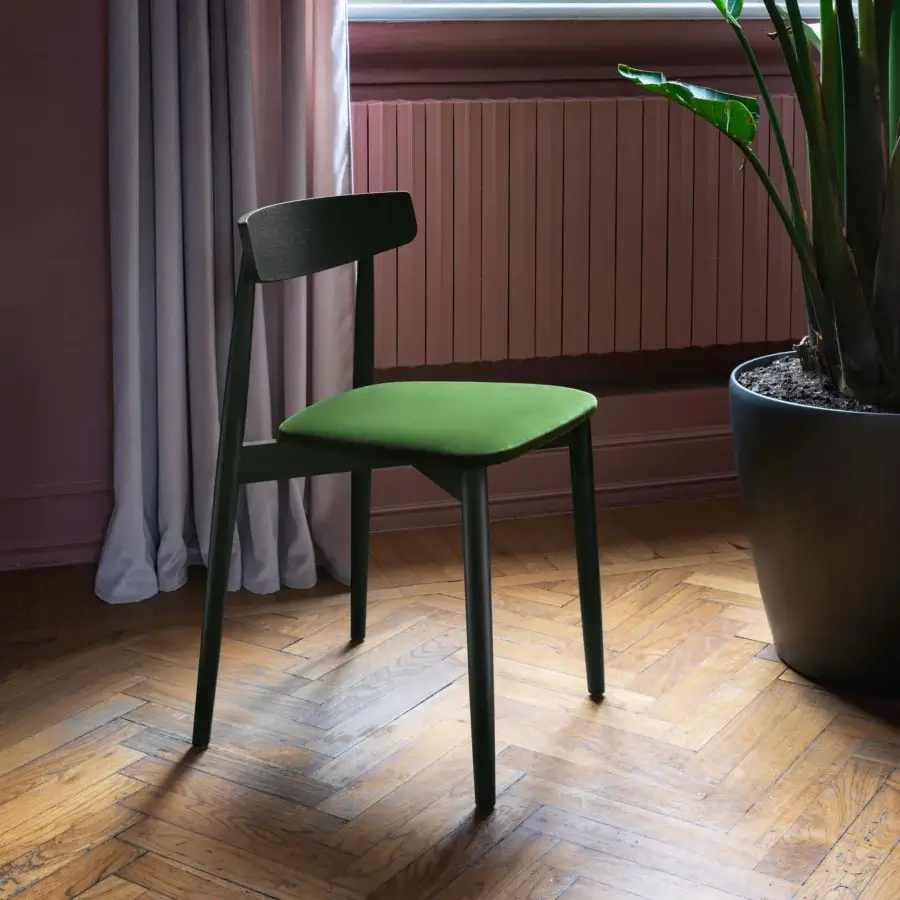Exceptional Miniforms Claretta chair crafted in wood with matte finish, featuring a green frame and brighter green textile seat