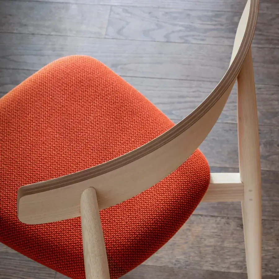 Superior Miniforms Claretta chair in light wood with vibrant orange woven textile and tilting backrest construction