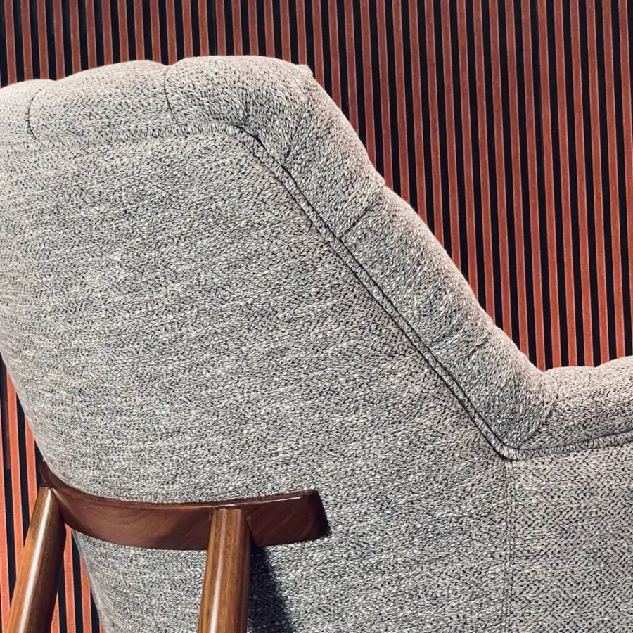 Superior Borzalino Eve Capitonnè lounge chair upholstered in mottled grey textile with lacquered oak wood base