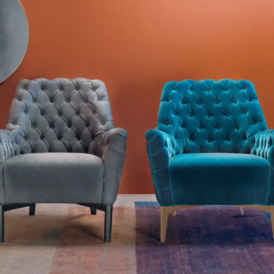 Distinguished Borzalino Eve Capitonnè lounge chair with hand-applied buttons in gray textile and lacquered oak legs
