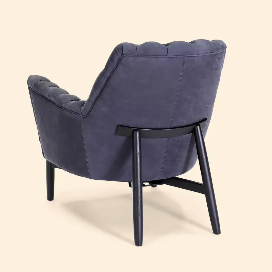 Superior Borzalino Eve Capitonnè lounge chair with tufted details and lacquered oak legs in muted blue-gray textile upholstery