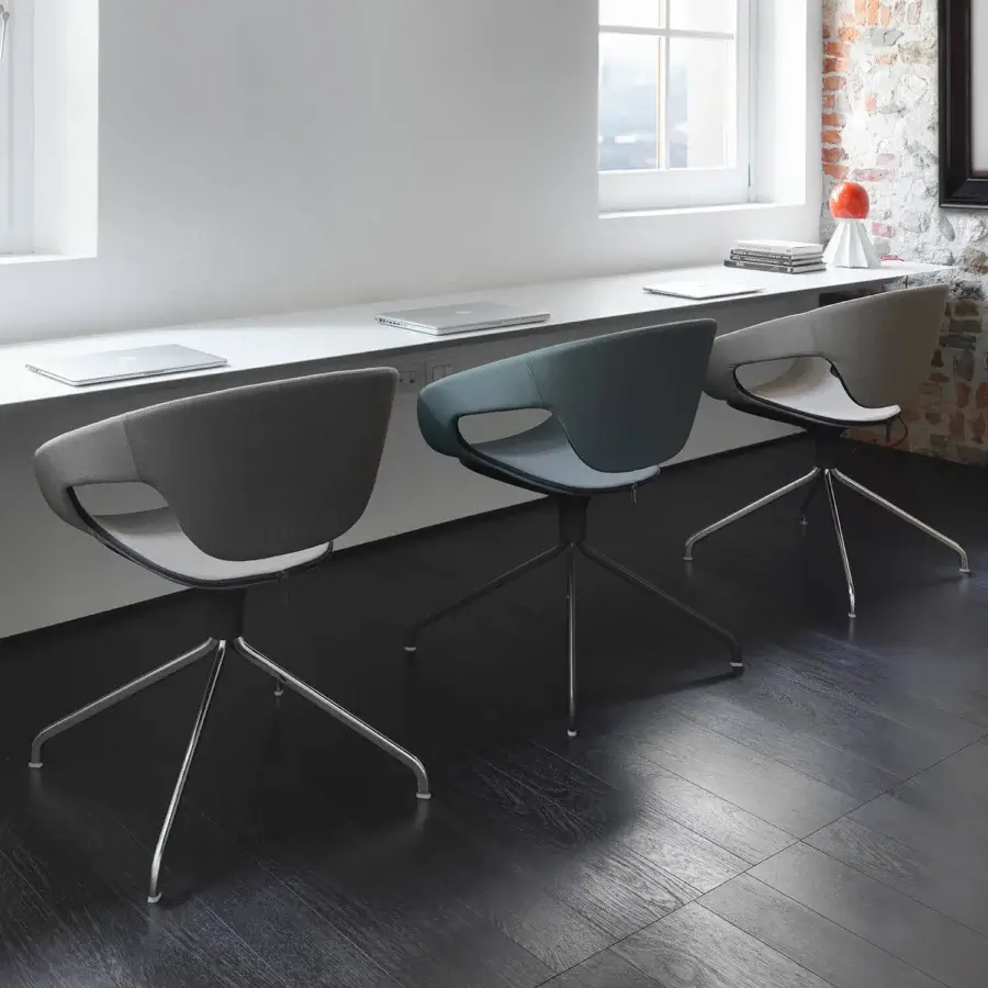 Sophisticated Casamania Vad armchair with light gray textile upholstery and high-end metal swiveling base