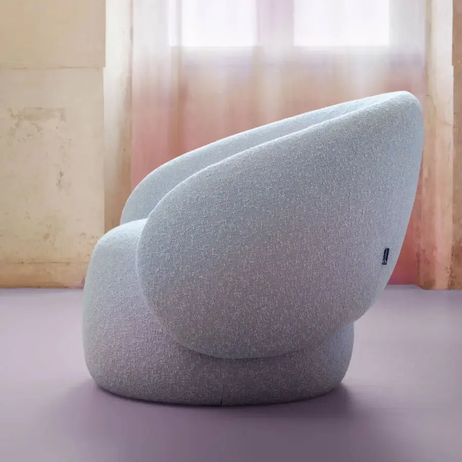 Superior Miniforms Nebulona lounge chair with curvaceous seat upholstered in textured light blue-gray textile