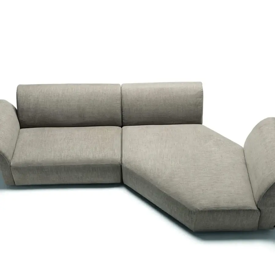 Lavish Frag Hug sectional with geometric shapes and botanical-inspired curved armrests upholstered in light gray textile