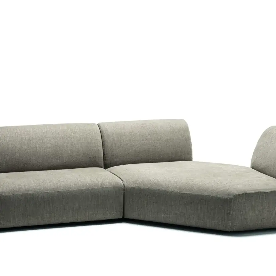 Superior Frag Hug sectional with geometric shapes and enveloping backrests upholstered in neutral gray textile with matte finish