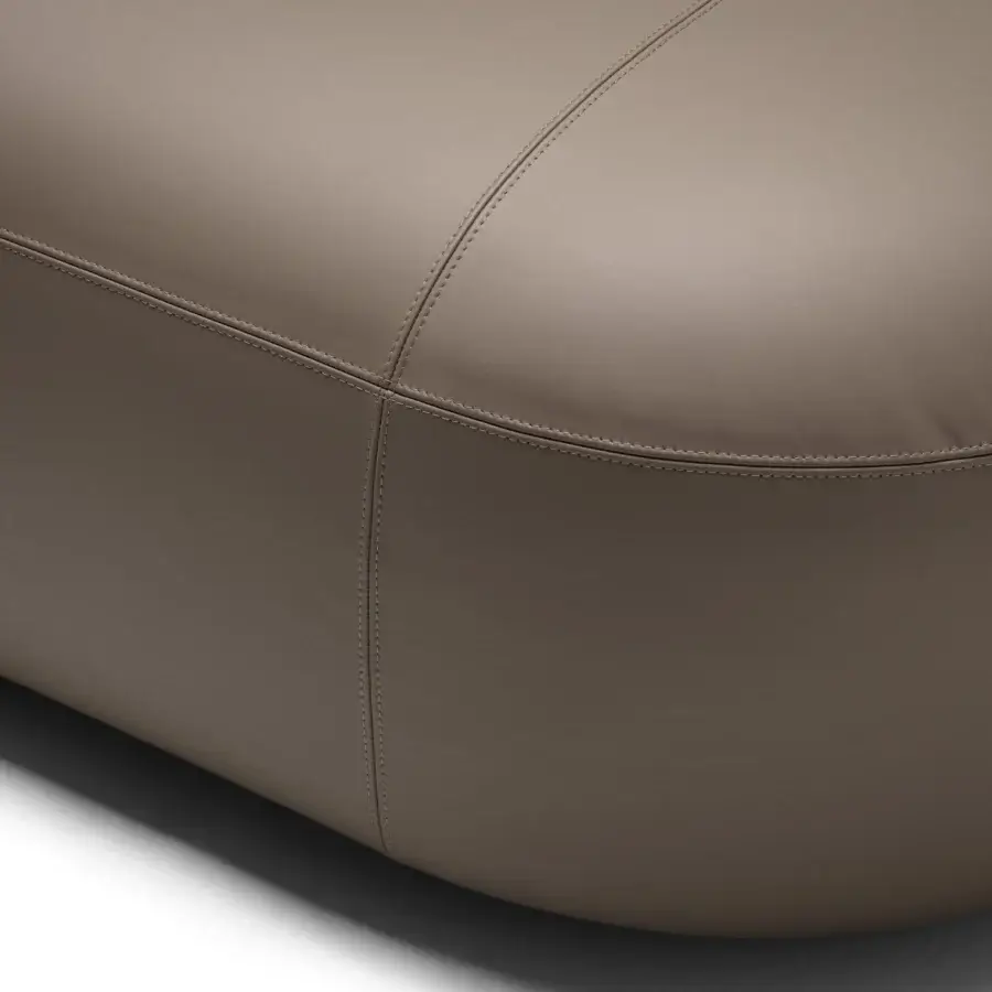 Captivating Frag Hug sectional with botanical petal-like armrests upholstered in uniform taupe with a smooth matte finish