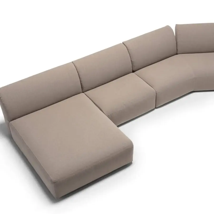 Distinguished Frag Hug sectional with geometric shapes and enveloping backrests upholstered in light beige textile with matte finish
