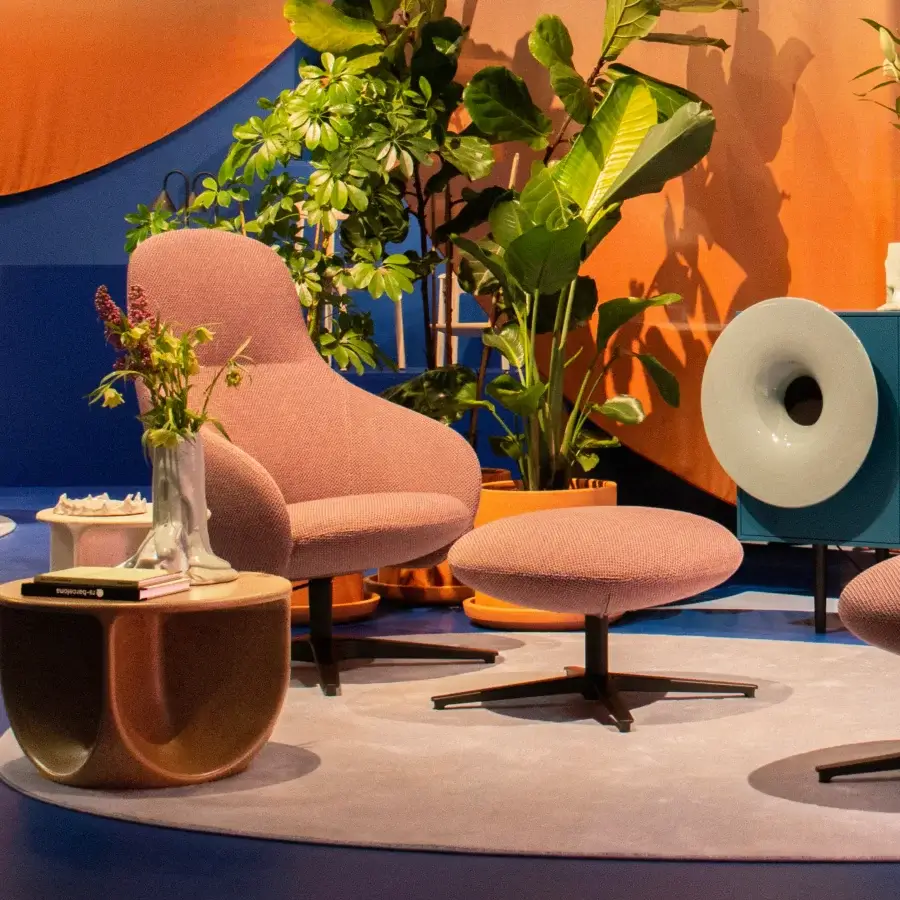 Distinguished Miniforms Nebula Alu lounge chair upholstered in muted pink textile with a matte finish and sleek dark metal base