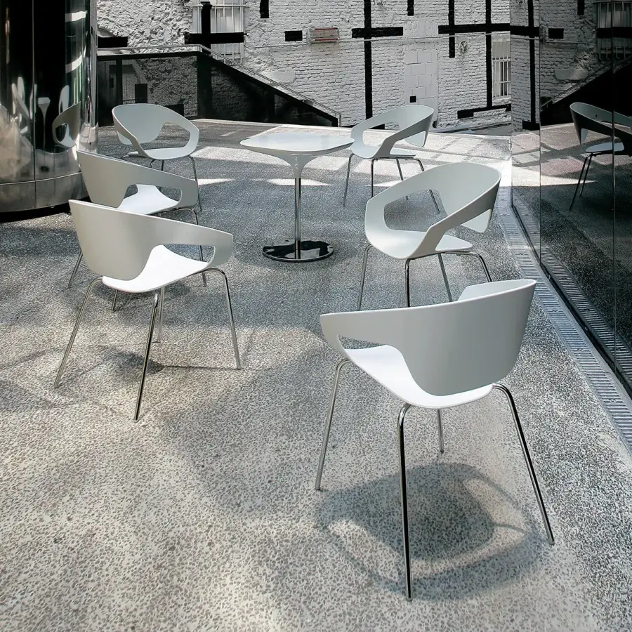 Superior Casamania Vad armchair with curved white polypropylene seat and sleek shiny metal legs crafted in Italy