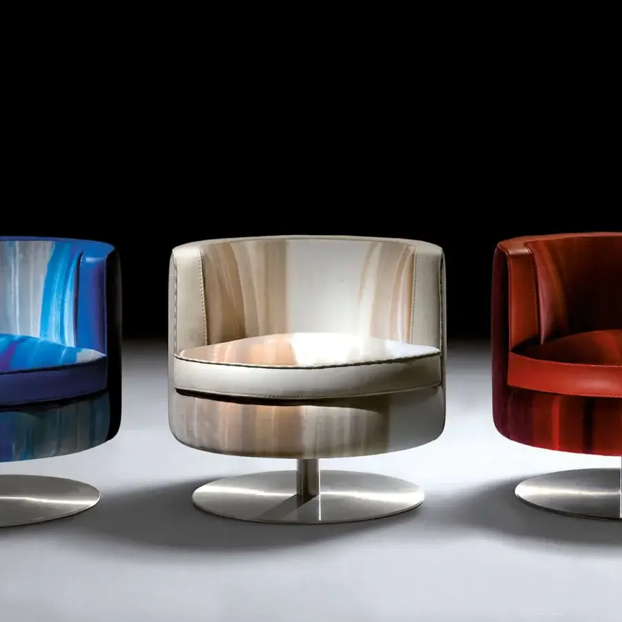 Distinguished Borzalino Frisbee lounge chair with reddish-brown textile upholstery and metal swivel base crafted in Italy