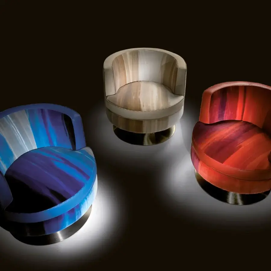 Captivating Borzalino Frisbee lounge chair with gradient textile upholstery and metal swivel base crafted in Italy