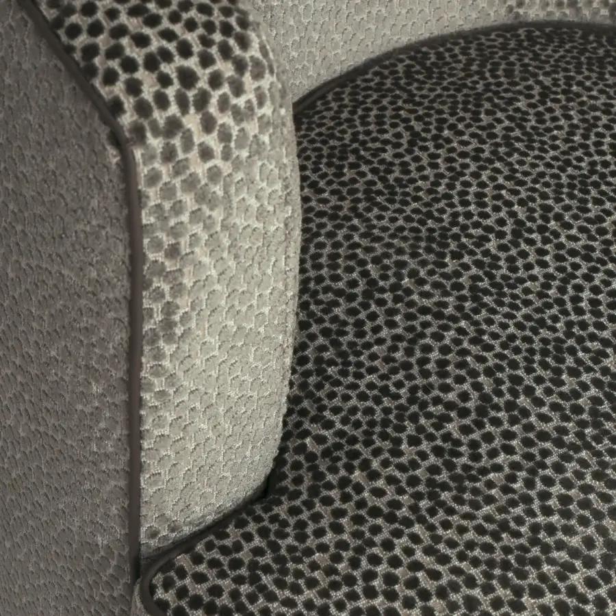 Distinguished Borzalino Frisbee lounge chair in scaled and spotted fabric with a metal swivel base and matte finish