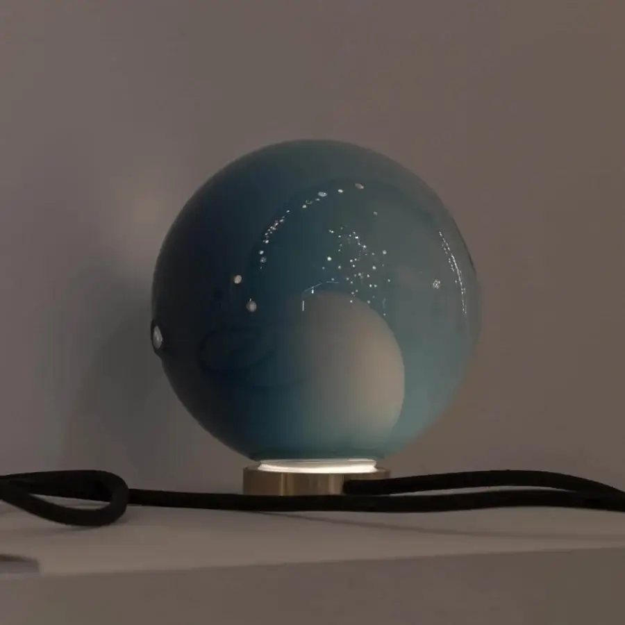 Exceptional Bocci 28 table lamp with a teal blown glass shade and sleek brass base crafted with reflective detailing
