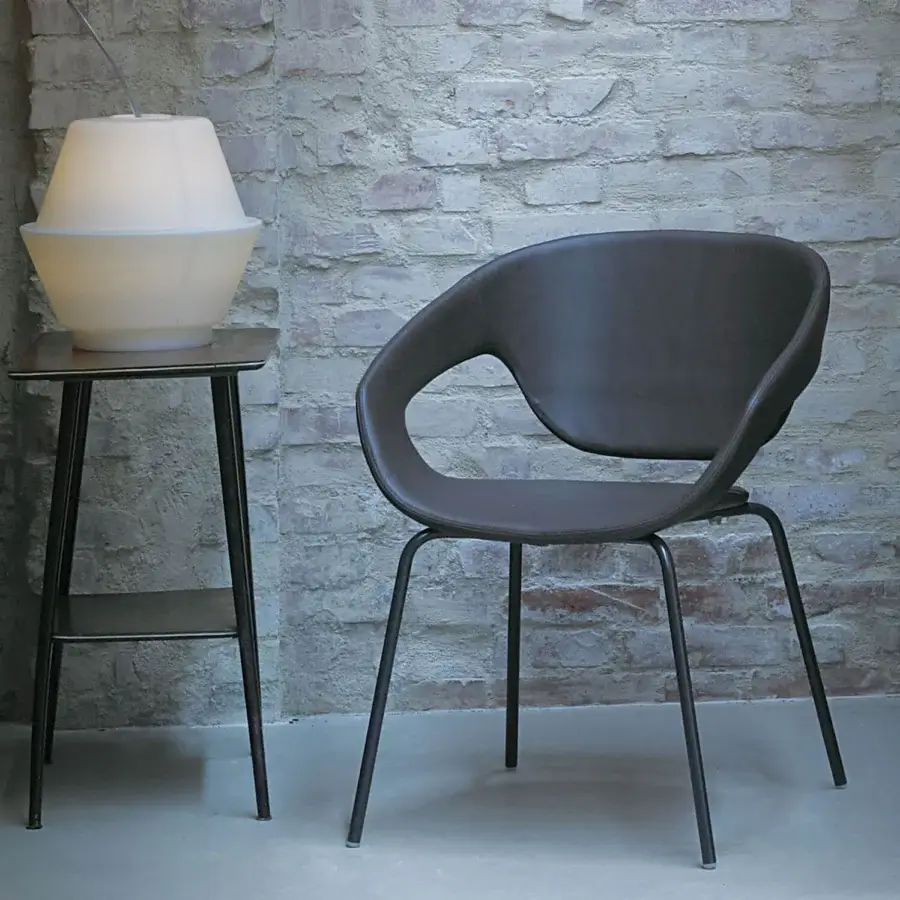 Sophisticated Casamania Vad armchair with dark gray matt polypropylene seat and sleek dark gray metal legs