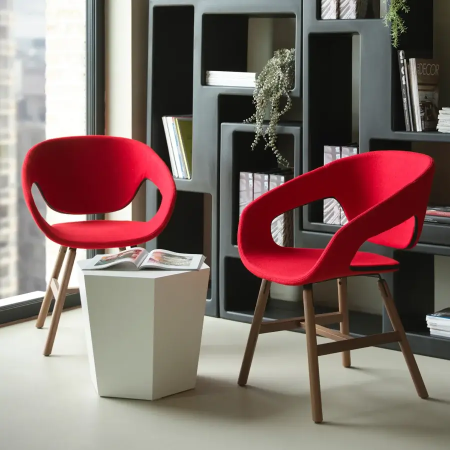 Distinctive Casamania Vad armchair with vibrant red fabric upholstery and a high-end wooden base