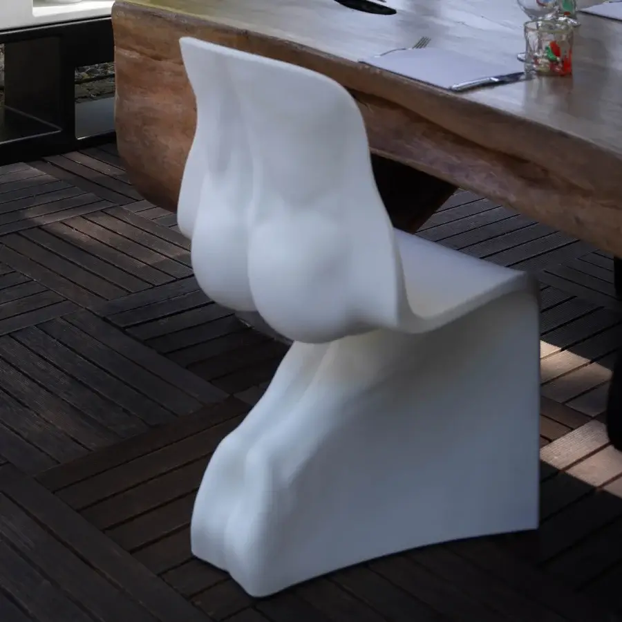 Distinctive Casamania Him & Her chair crafted in all-white rotationally mass-dyed molded polyethylene with organic sculpted form