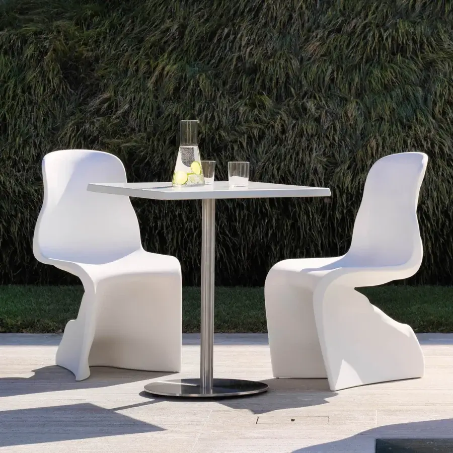 Superior Casamania Him & Her chair with organic form crafted in bright white rotationally mass-dyed molded polyethylene and glossy finish