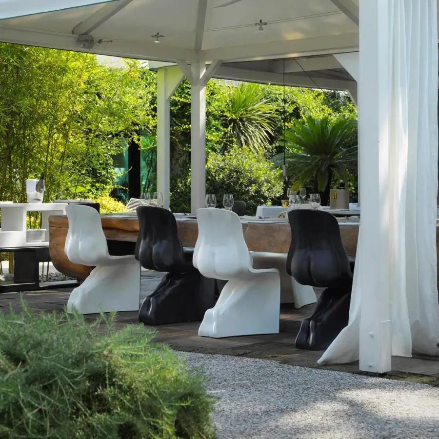 Elegant Casamania Him & Her chair with sculpted form crafted in glossy white and black rotationally molded polyethylene