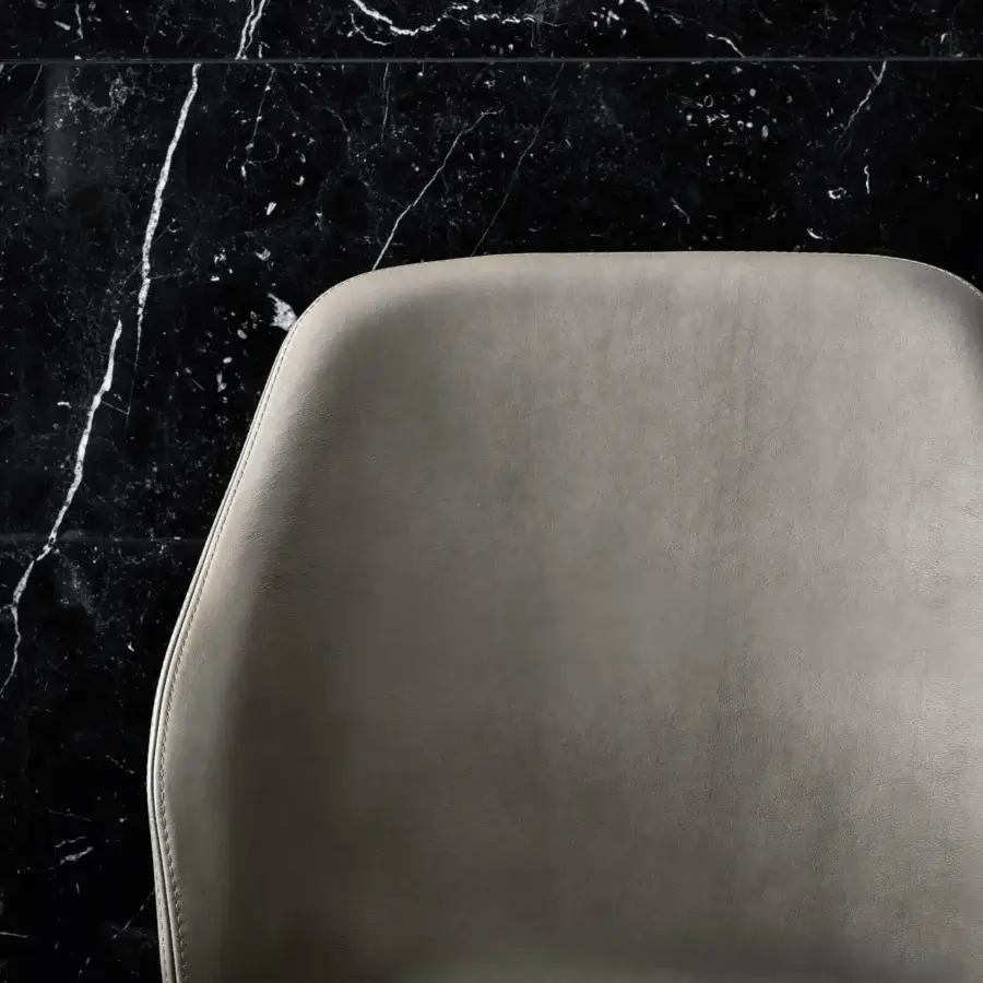 Distinguished Frag Doa chair with gentle curves and visible timber frame upholstered in smooth light gray textile crafted in Italy