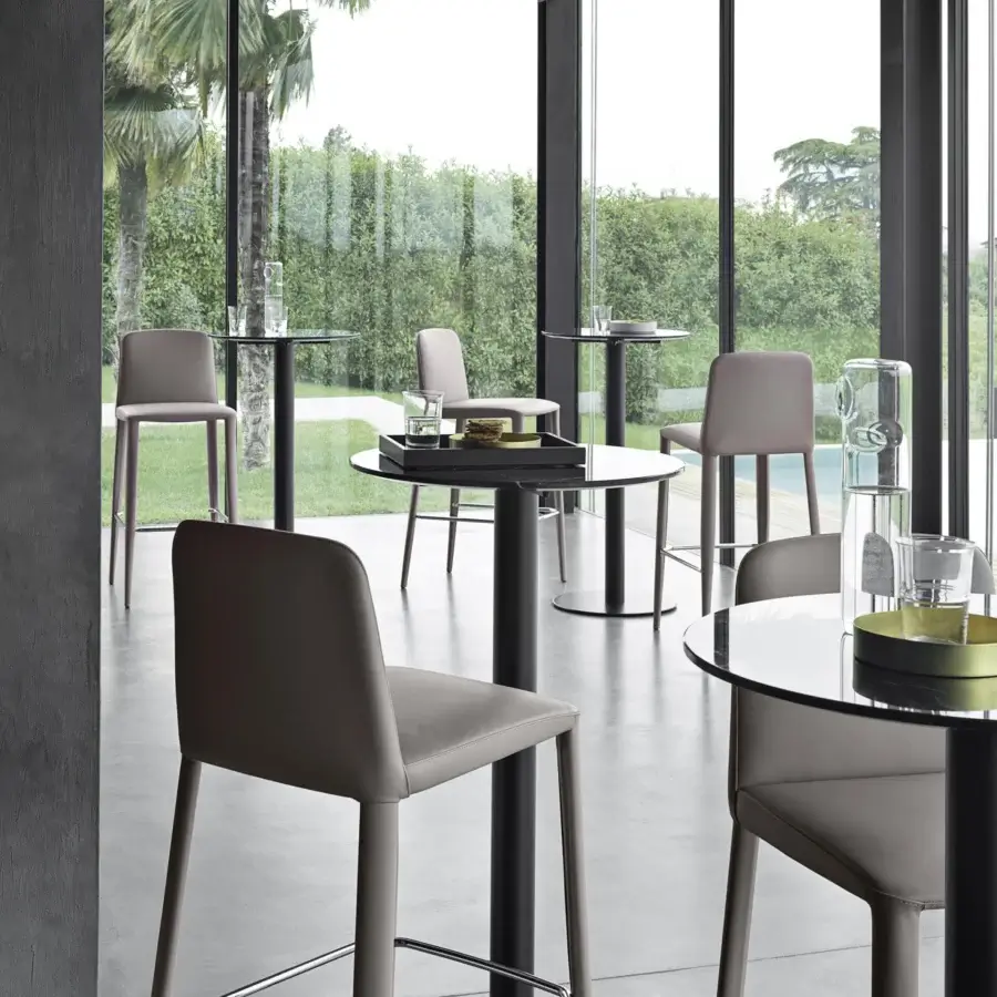 Distinguished Frag Elf stool crafted in Italy with light gray upholstery, chrome footrest and matte black metal base