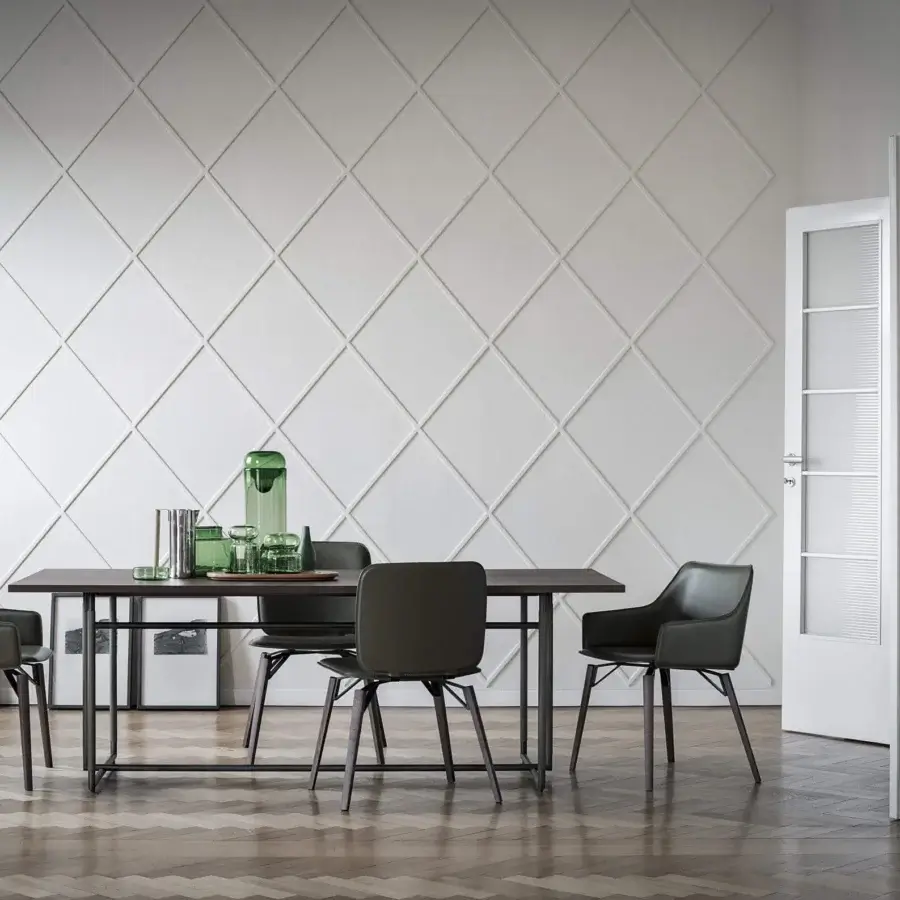 Harmonious Frag Iki chair with dark textile upholstery and sleek dark wood legs crafted in Italy