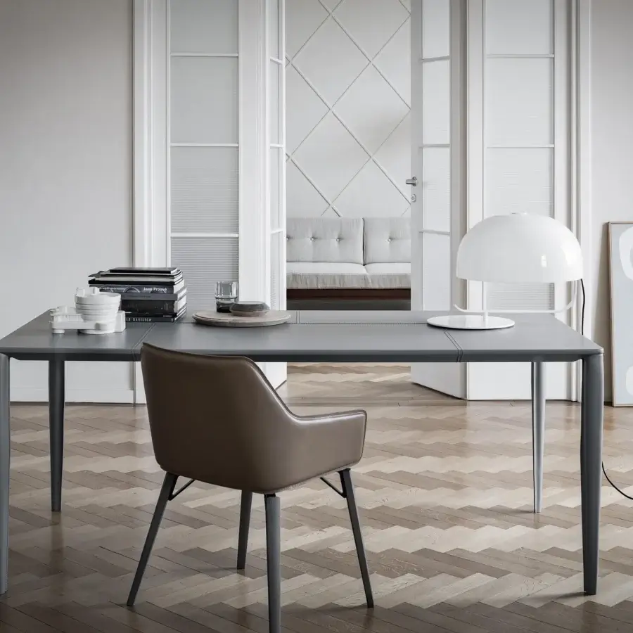 Distinguished Frag Iki chair crafted in Italy with saddle leather upholstery and a dark gray metal frame