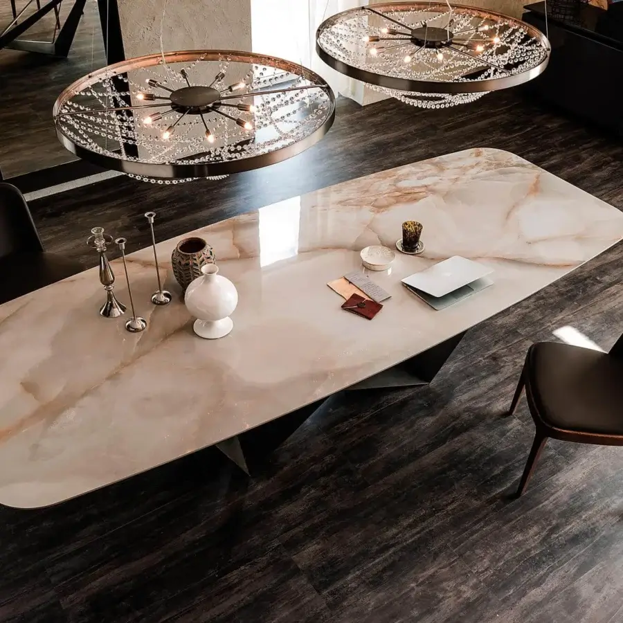 Distinguished Cattelan Italia Skorpio table with shaped ceramic top displaying cream, beige, orange and brown veining plus embossed lacquered steel base