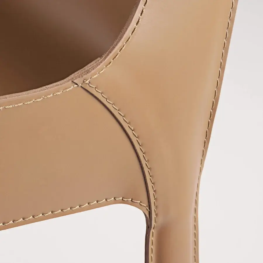 Sophisticated Frag Nisida chair upholstered in light tan Saddle Leather with decorative stitching and metal frame