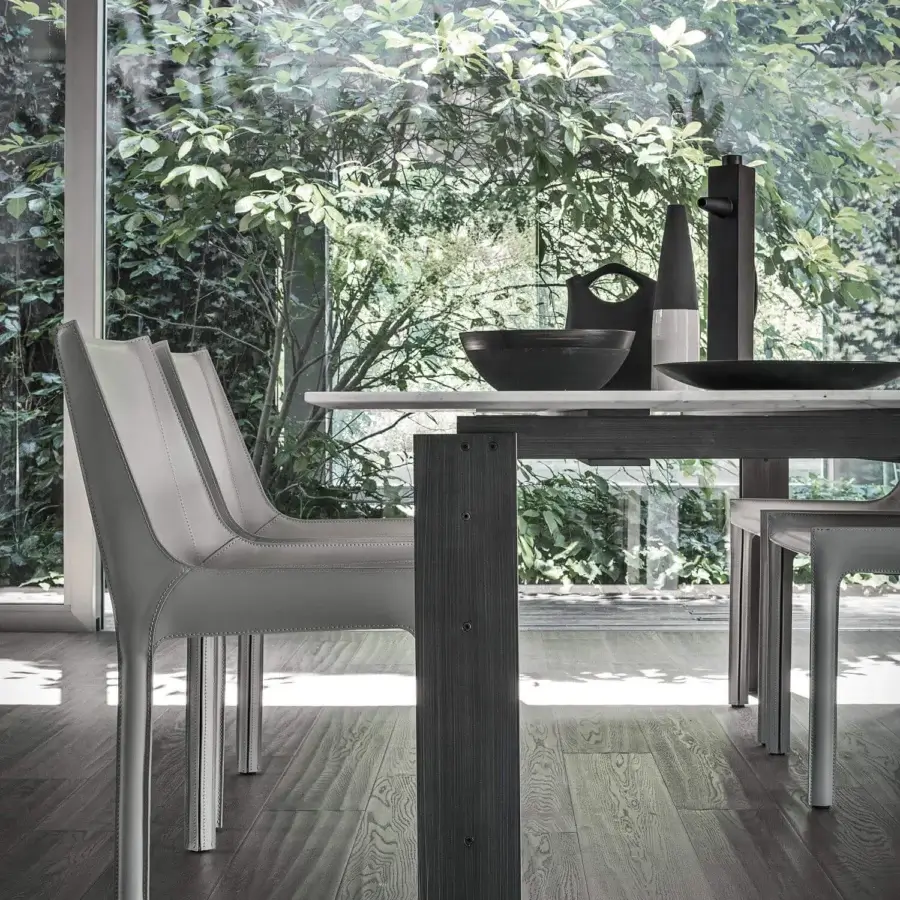 Elegant Frag Nisida chair upholstered in light gray Saddle Leather with a slender silver metal frame crafted in Italy