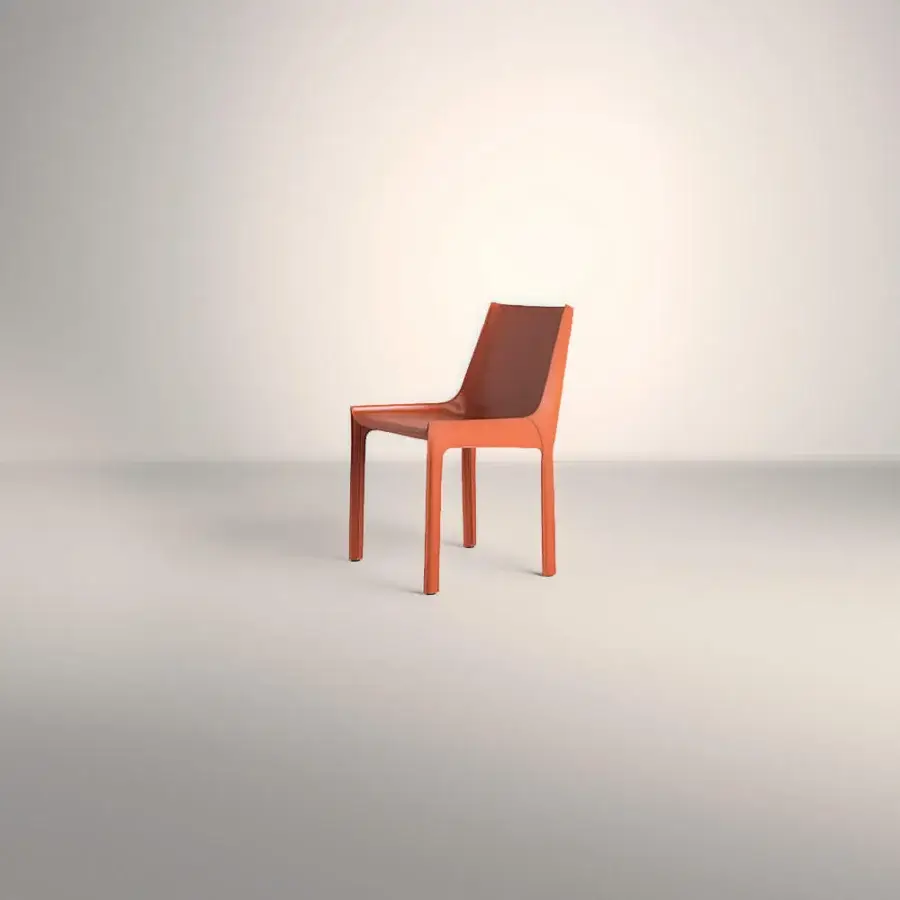 Lavish Frag Nisida chair upholstered in muted orange Saddle Leather with a matte finish and metal frame