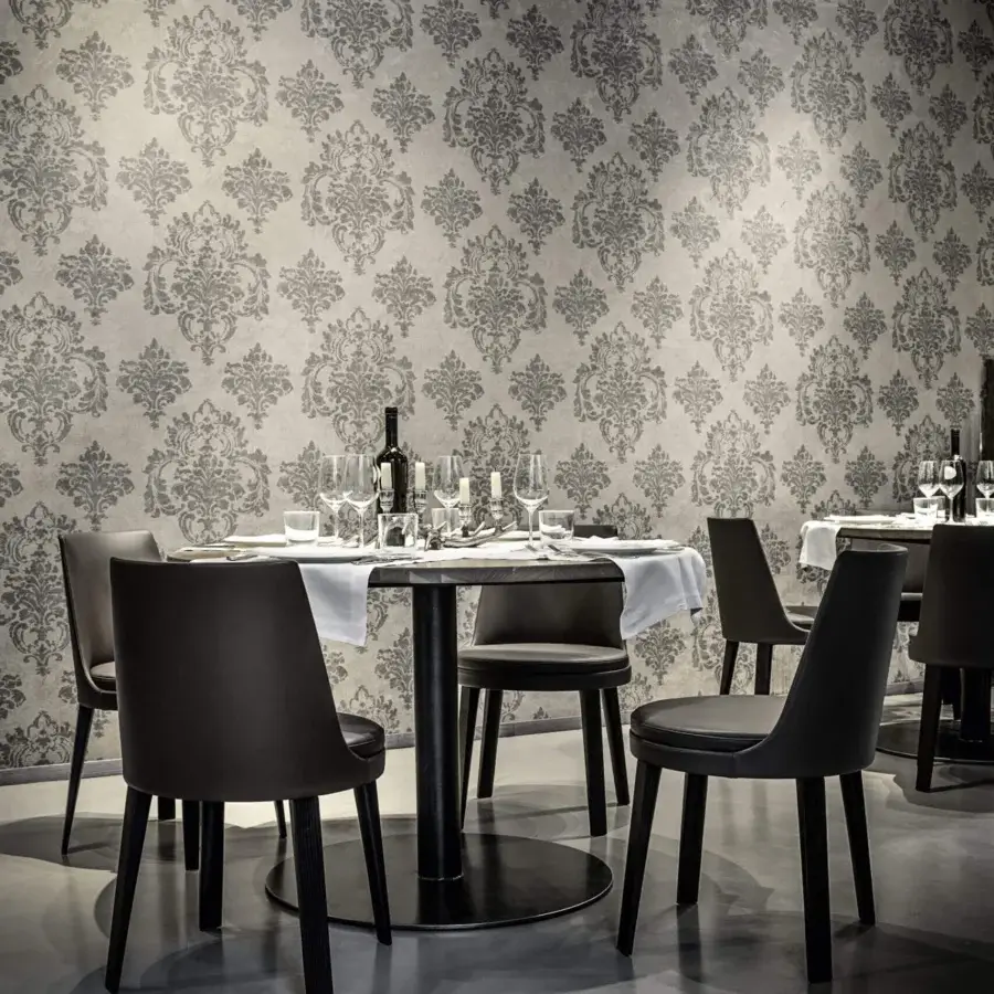 Exceptional Frag Ponza chair upholstered in dark matte material with sleek straight dark wooden legs