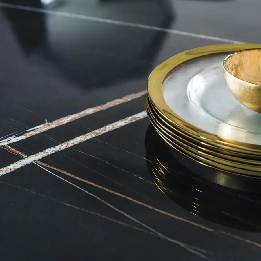 Lavish Cattelan Italia Skorpio table crafted with a shaped Marmi ceramic top in dark linear patterned white and brown with black embossed lacquered steel