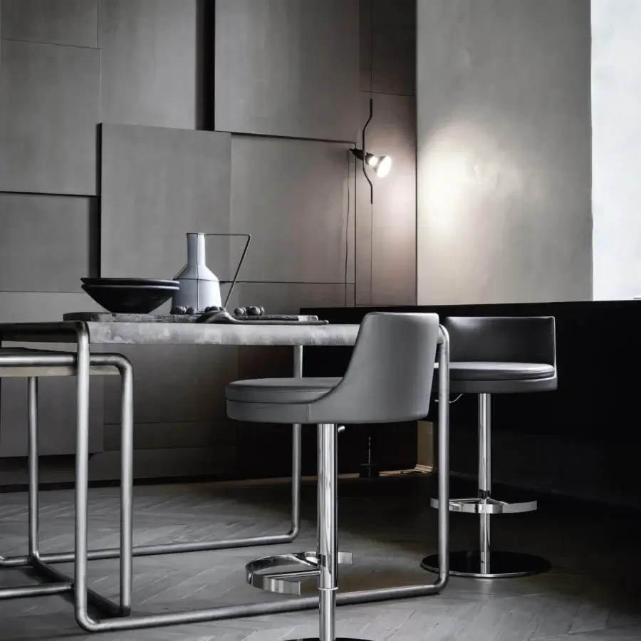Superior Frag Ponza stool with gray rounded seat crafted from supple leather and polished metal base with circular footrest