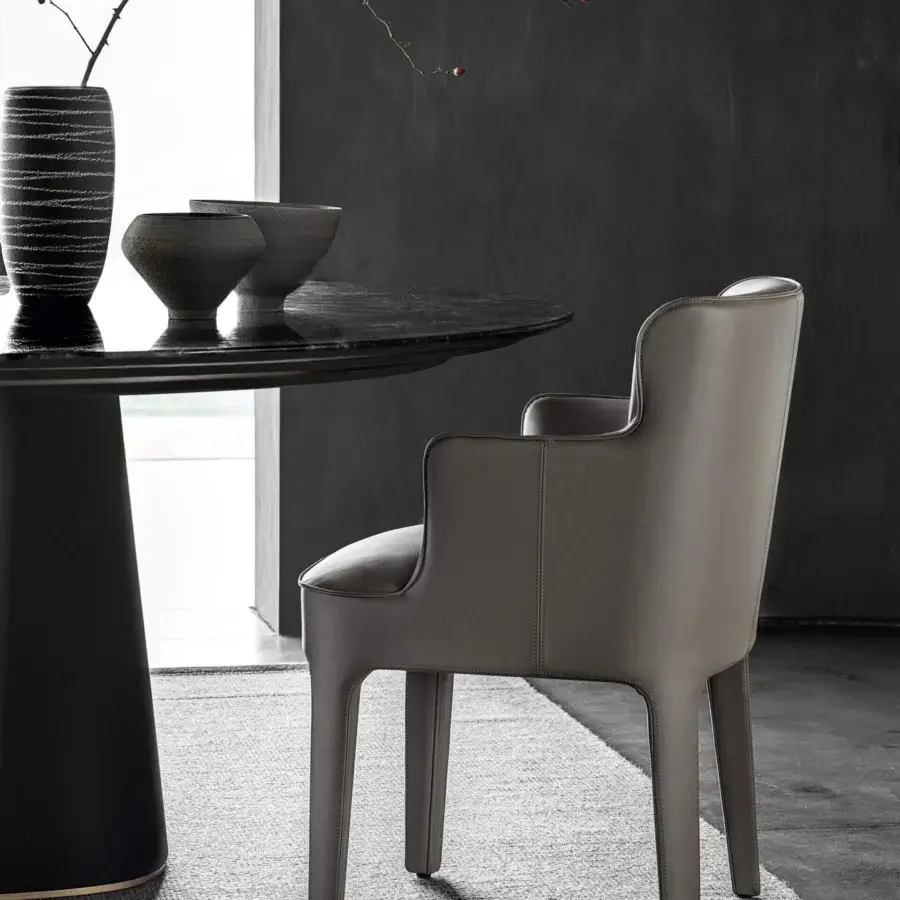 Distinguished Frag Public chair with fluid lines forming legs, seat, and integrated armrests in light gray fabric