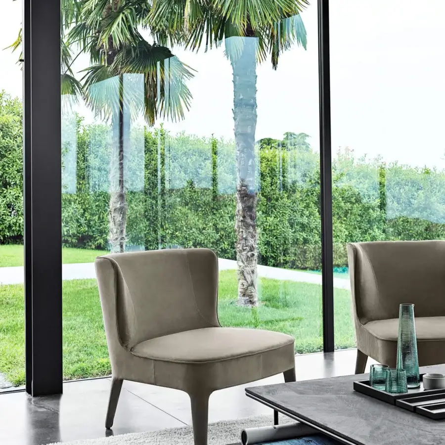 Exceptional Frag Public lounge chair upholstered in muted taupe textile with a matte finish presents a seamless contemporary silhouette