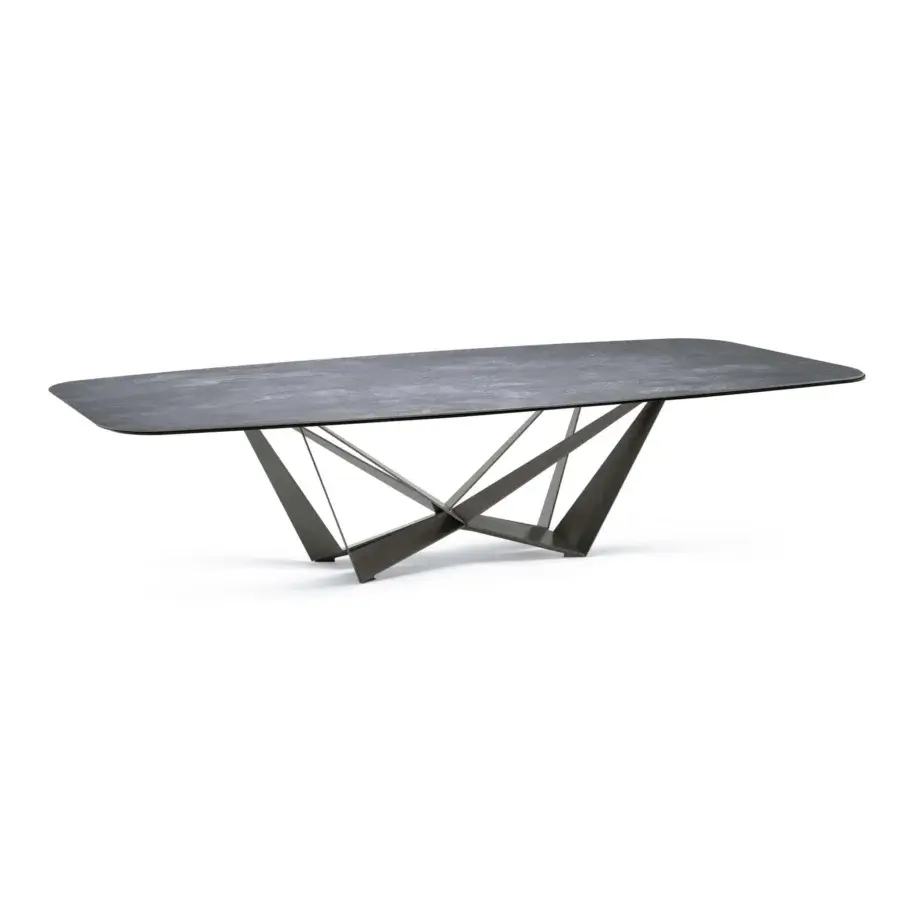 Distinguished Cattelan Italia Skorpio table with dynamically intersecting titanium embossed steel base and dark gray matte Marmi ceramic top