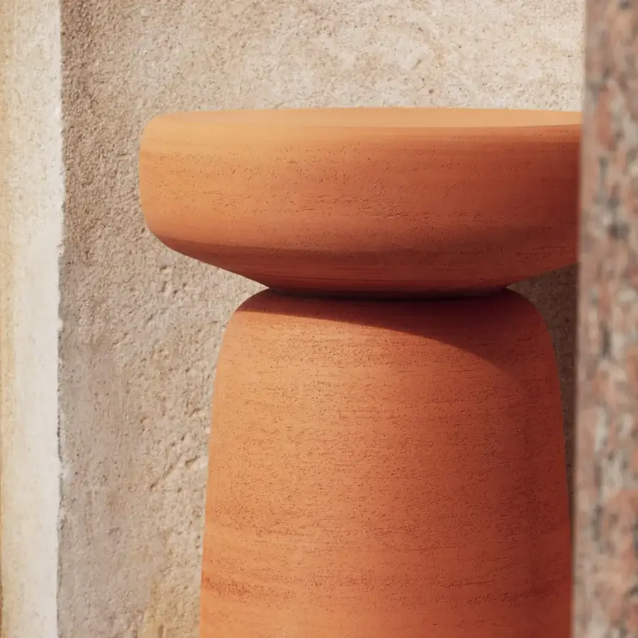Distinguished Miniforms Tototò side table in terracotta with organic curves and a textured matte finish