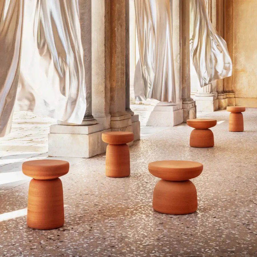 Exceptional Miniforms Tototò side table in reddish-brown terracotta with a soft matte finish and organic drum silhouette