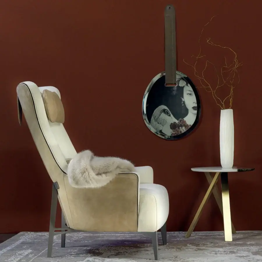 Distinguished Borzalino Mia lounge chair upholstered in light cream fabric and tan suede-like leather with dark gros-grain ribbon detail and matte lacquered legs