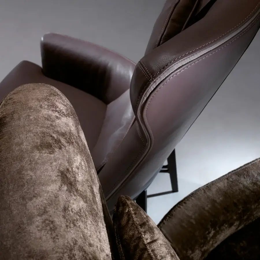 Distinguished Borzalino Mia lounge chair crafted in smooth leather and textured textile with a powder-coated metal base