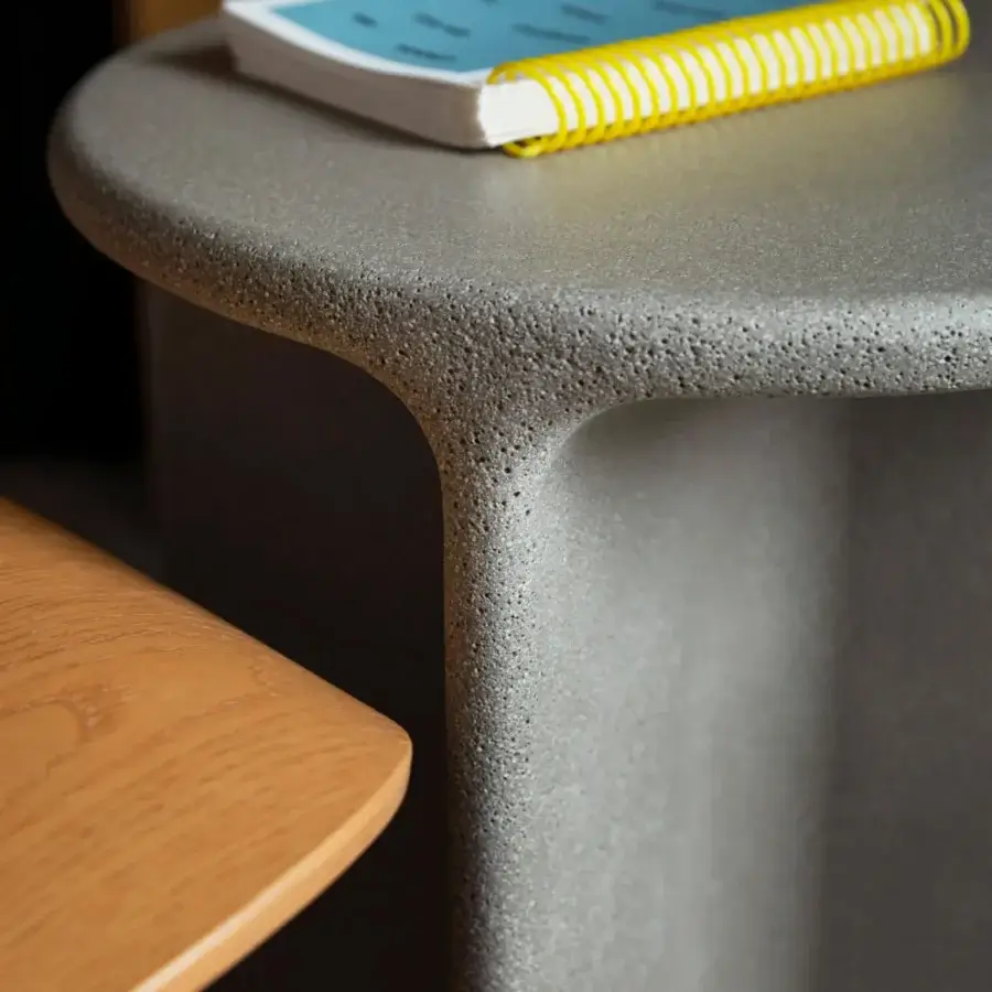 Superior Miniforms Pinto side table with rounded light gray form crafted from unique composite material for indoor or outdoor use