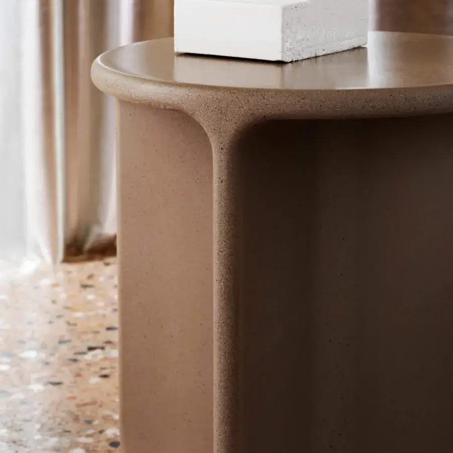 Distinguished Miniforms Pinto side table with rounded silhouette and medium brown mottled tones in a textured matte finish