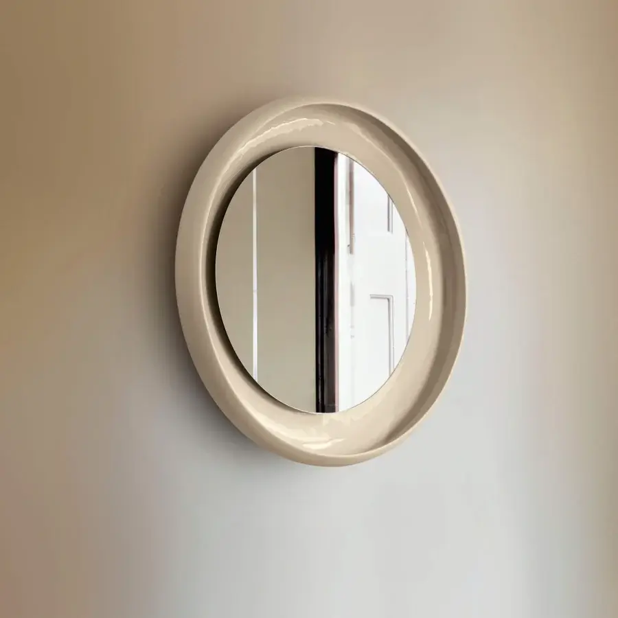 Exceptional Miniforms Coque mirror with a textured outer skin and shiny enamelled inner surface in beige
