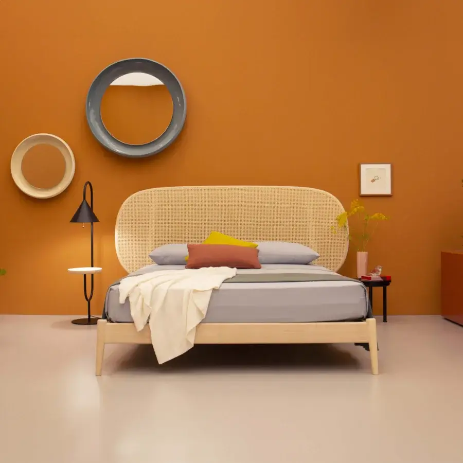 Distinguished Miniforms Shiko Wien bed with light-toned wood frame and rounded headboard crafted in woven cane-like material