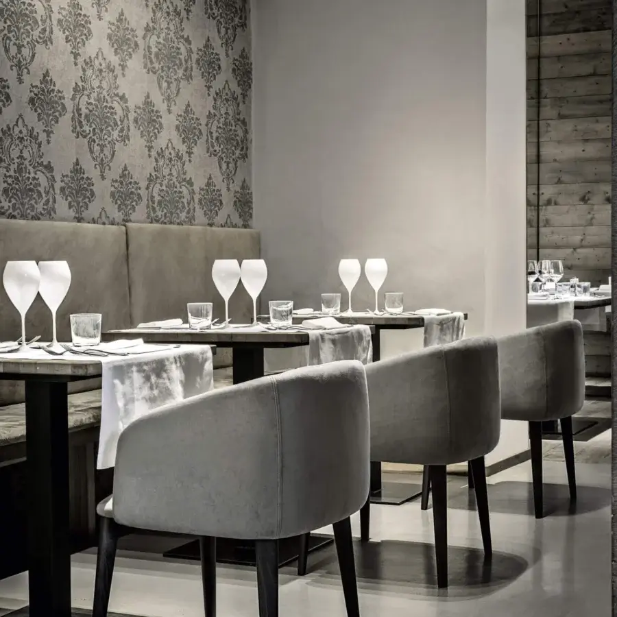Distinguished Frag Sofy armchair upholstered in soft gray Leather with walnut-tinted Ash wood legs