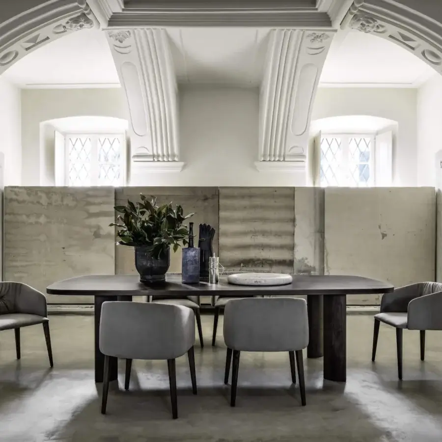Lavish Frag Sofy armchair upholstered in smooth light grey Leather with walnut-tinted Ash wood legs
