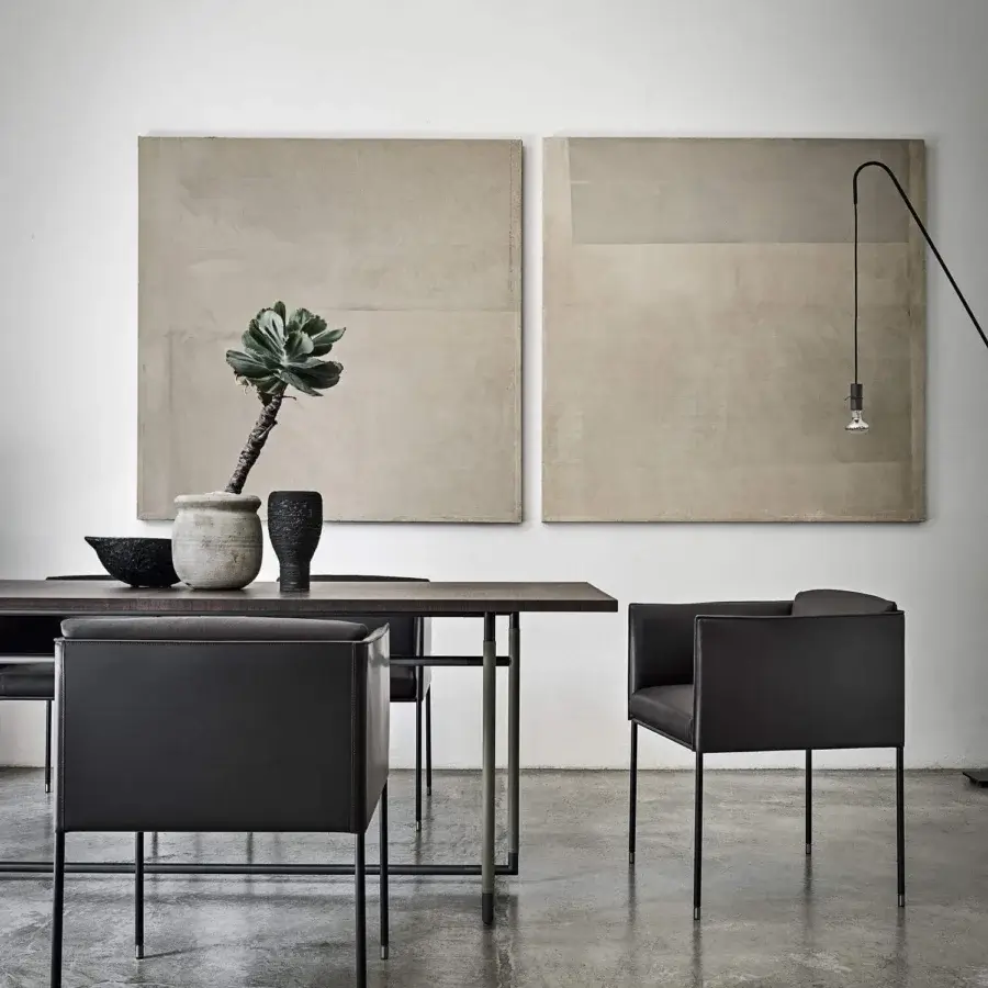 Elegant Frag Square Armchair upholstered in dark gray material with matte finish and slender metal legs